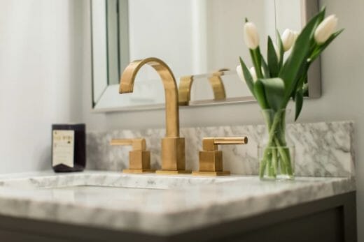 bath vanity sink with brass faucet