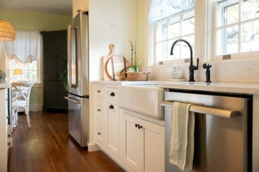 Charleene's-Houses-MD-baltimore-towson-kitchen-renovation-white-cabinets-black-cabinet-hardware-light-open-kitchen-black-plumbing-fixture-farm-house-sink
