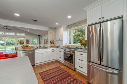 Charleene's-Houses-MD-baltimore-towson-kitchen-renovation-white-cabinets-black-cabinet-hardware-light-open-kitchen-patterned-tile-backsplash