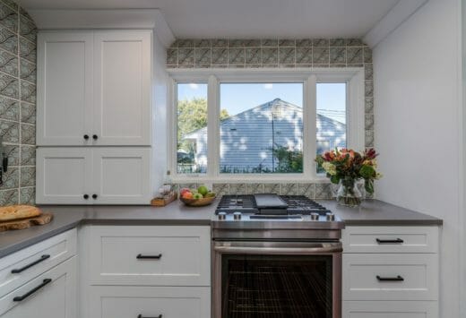 Charleene's-Houses-MD-baltimore-towson-kitchen-renovation-white-cabinets-black-cabinet-hardware-light-open-kitchen-patterned-tile-backsplash