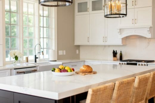 Charleene's-Houses-MD-baltimore-towson-kitchen-renovation-dark-blue-island-white-kitchen-cabinets-brass-cabinet-hardware-cafe-farm-house-sink