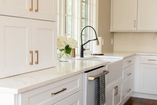 Charleene's-Houses-MD-baltimore-towson-kitchen-renovation-dark-blue-island-white-kitchen-cabinets-brass-cabinet-hardware-cafe-farm-house-sink