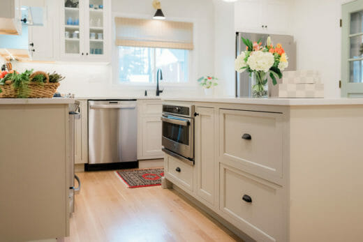 Charleene's-Houses-baltimore-MD-kitchen-renovation-beige-cabinets-beige-island-black-faucet