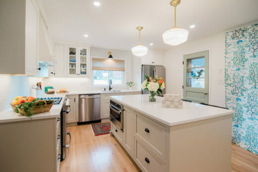 Charleene's-Houses-baltimore-MD-kitchen-renovation-beige-cabinets-beige-island-black-faucet-brass-hanging-island-pendants