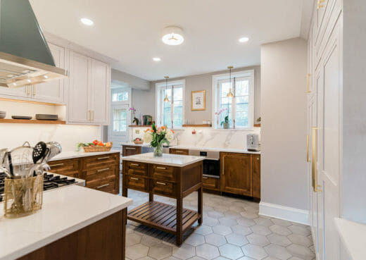 Charleene's-Houses-MD-kitchen-renovation-wood-cabinets-brass-hardware-stainless-steel-sink-floating-shelves-hexagon-floor-tile-small-island