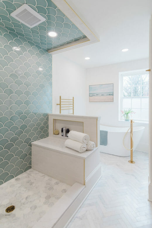 Charleene's-Houses-MD-baltimore-master-bathroom-renovation-scalloped-wall-tile-brass-plumbing-fixtures-hidden-niche-shower-bench-hexagon-floor-tile-stand-alone-tub-brass-tub-filler-towel-warmer