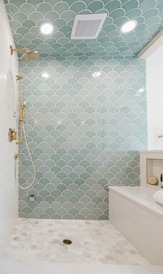 Charleene's-Houses-MD-baltimore-master-bathroom-renovation-scalloped-wall-tile-brass-plumbing-fixtures-hidden-niche-shower-bench-hexagon-floor-tile