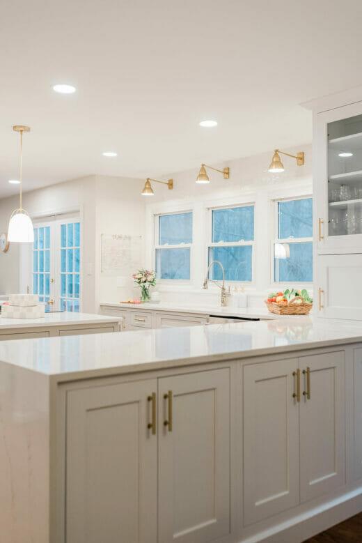 Kitchen-remodel-Polished-Nickel- Fixtures-Brass-Sconces-Brass- Cabinet-Hardware-White- Cabinets-Marble-Countertop