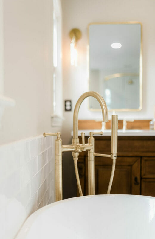 Master-Bath-Renovation-Stand- Alone-Tub-Brass-Fixtures-Herringbone-Floor-Tile-Oak Vanity