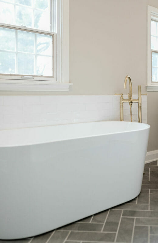 Master-Bath-Renovation-Stand-Alone-Tub-Brass-Fixtures-Herringbone-Floor-Tile