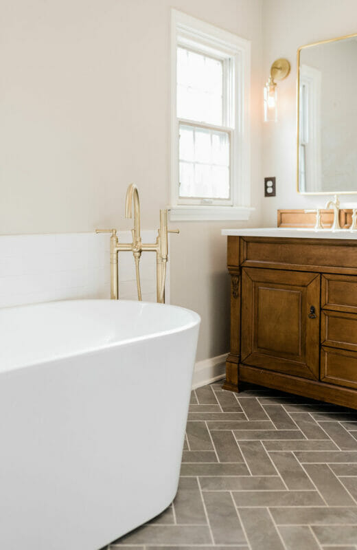 Master-Bath-Renovation-Stand- Alone-Tub-Brass-Fixtures-Herringbone-Floor-Tile-Oak-Double-Vanity