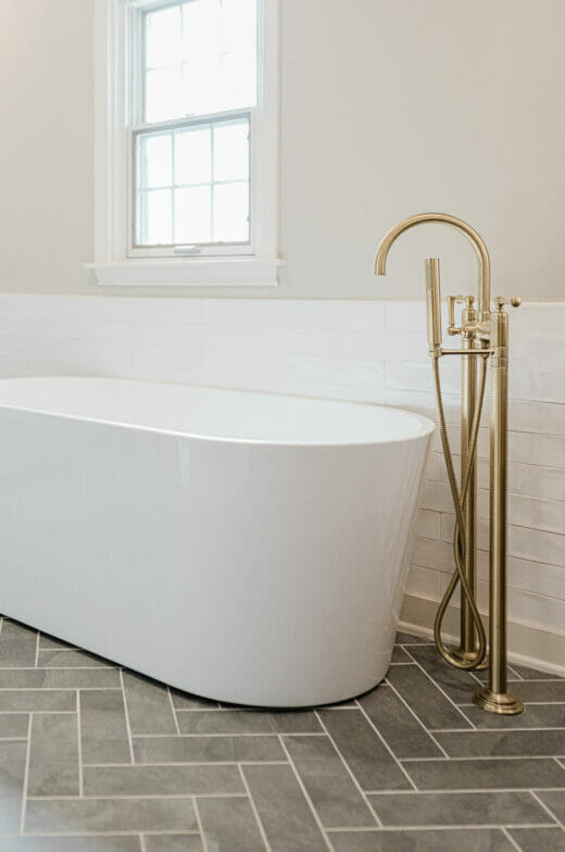 Master-Bath-Stand-Alone-Tub-Brass-Fixtures-Herringbone-Floor- Tile