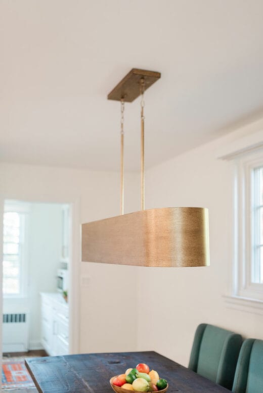 brass light over dining table
