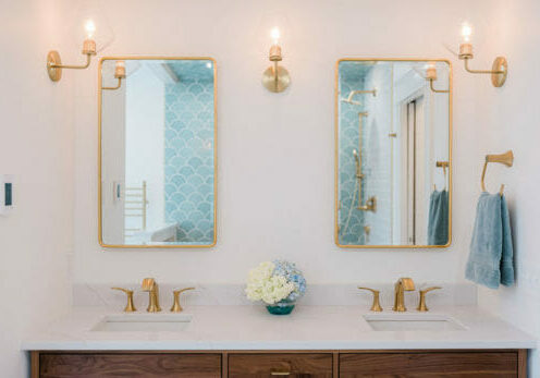 Charleene's-Houses-MD-baltimore-master-bath-renovation-double-vanity-wood-vanity-brass-faucets-brass-medicine-cabinets-brass-sconces-brass-towel-ring-scalloped-shower-tile