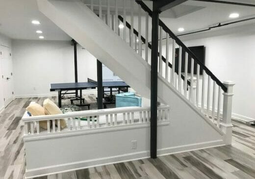 basement remodel white open staircase